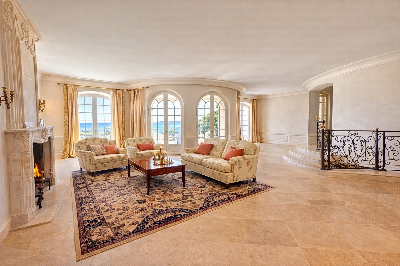 Grand salon with fireplace and sea views